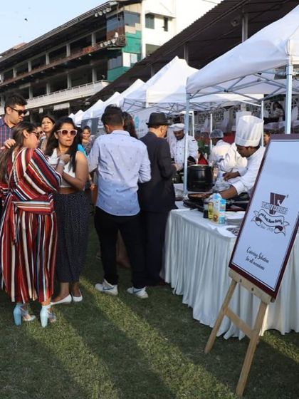 A glimpse of the lively atmosphere at our catering setup for the VIP Lounge at Mahalaxmi Racecourse. Our live food stations become a central point for guests to gather and enjoy the event.