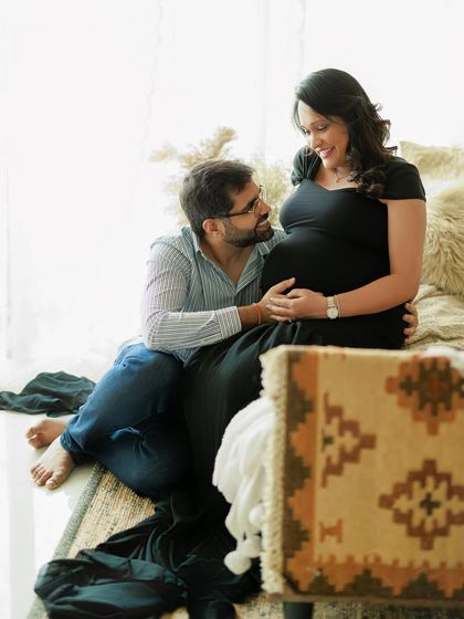 A candid moment during a cozy studio session. The way he looks at her with so much love and admiration is what makes this portrait so precious.