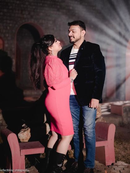 A candid and interactive shot from the same night session, capturing a look of love between the couple. This shows the blend of posed and natural moments I capture.