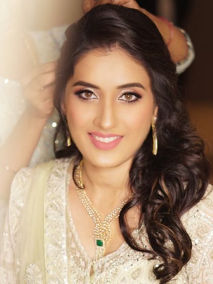 Timeless elegance for the stunning bride Anuja. This look features effortless glamour with soft glittery eyes, flawless glowing skin, and a delicate pink lip to complete her bridal glow.