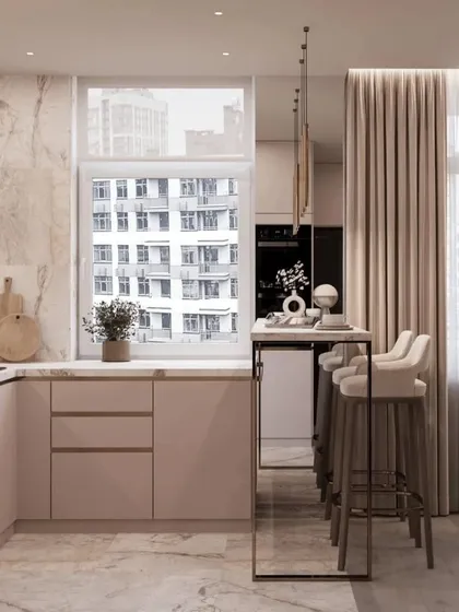 This angle highlights the breakfast bar, which is perfect for quick meals or as an extra workspace. The large window provides plenty of natural light.