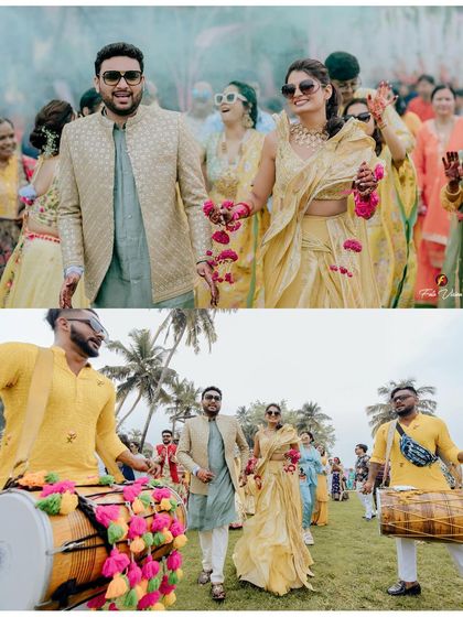 The grand entrance of the couple at their Goa Haldi ceremony, accompanied by dhol players. We capture the energy and excitement of these traditional processions.