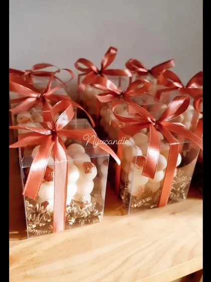 Our iconic bubble candle, shown here in a new packaging style. The clear box and ribbon make it a perfect, ready-to-gift item for corporate events, weddings, or party favors.