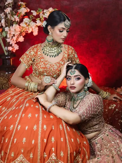 A final shot from our editorial series, capturing a moment of connection between the two models. Their flawless makeup remains perfect under professional lighting.