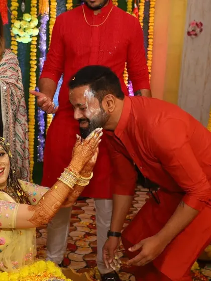 A playful moment during the Haldi ceremony. It's all about creating happy memories.