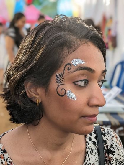 A graphic black swirl design accented with patches of silver glitter.