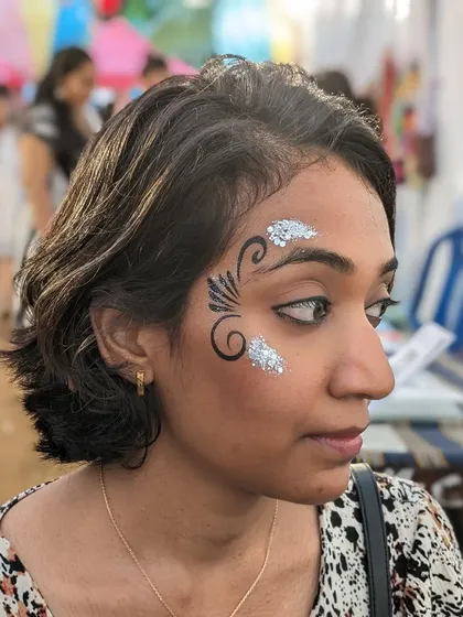 A graphic black swirl design accented with patches of silver glitter.