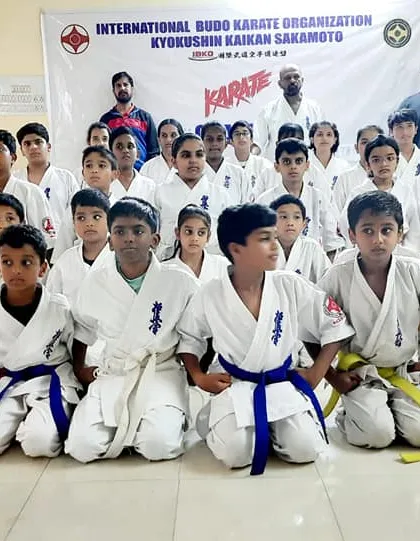 Students pose with their instructors after the grading. We are a team, and we celebrate these achievements together.