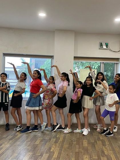 Our amazing kids' batch striking a pose after their Latin dance class. They absolutely killed it!