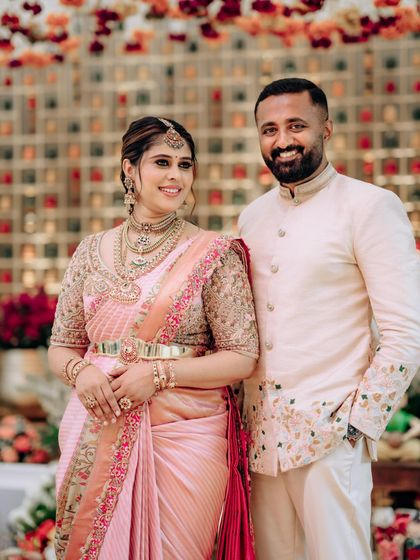 A portrait of my husband and me from our baby shower. Our coordinated outfits were designed to be elegant and comfortable for the special day.