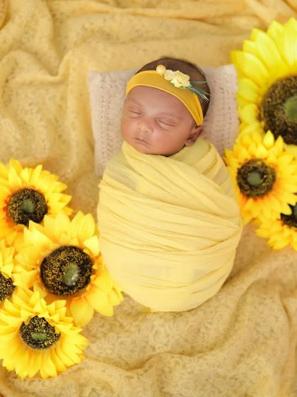 A little ray of sunshine surrounded by bright sunflowers. This setup is so cheerful and happy, just like a new baby. 💛