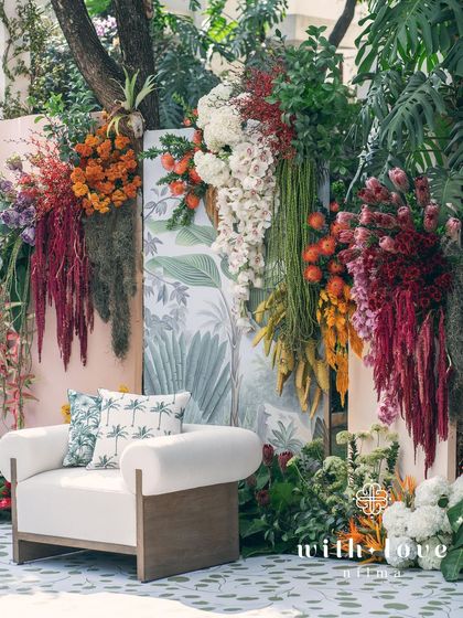 The full seating arrangement for the 'Garden of Gaia' ceremony, with the lush floral wall as the stunning focal point.