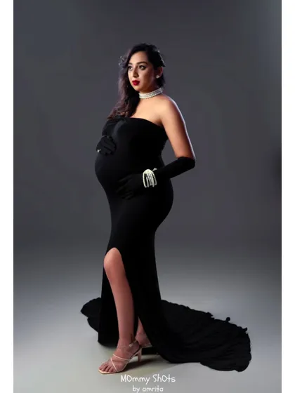 For this stunning maternity shoot, we went for a classic Hollywood glamour theme. I created a bold look with a striking red lip and defined eyes to complement the elegant black strapless gown, ensuring the mom-to-be felt absolutely radiant.