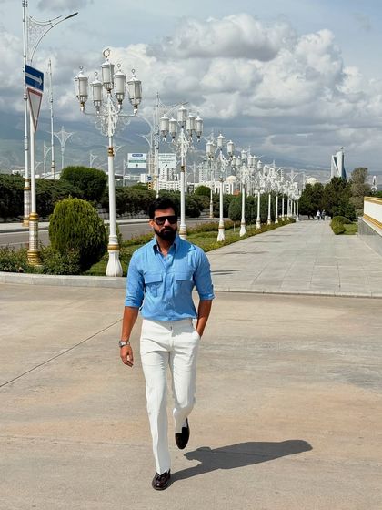 A walking shot that showcases the full outfit, demonstrating a confident and polished look perfect for a day of sightseeing.