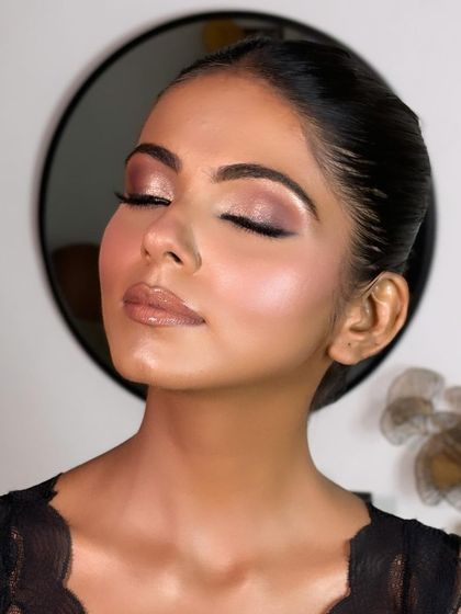 With eyes closed, you can really appreciate the soft blend of the eyeshadow. This look is a perfect example of how to create a sophisticated yet glamorous eye for an evening event.