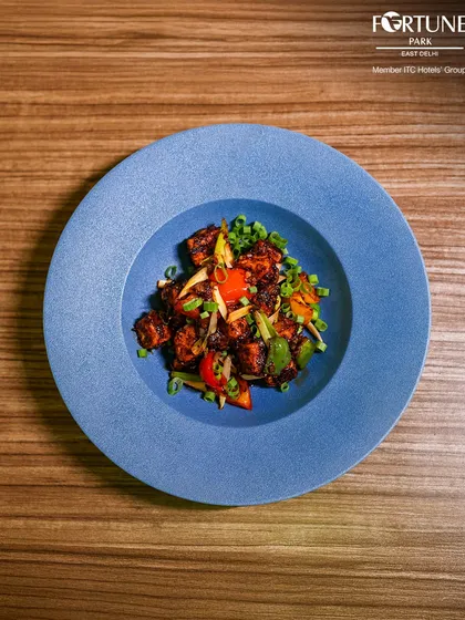 Our Chilli Paneer is a crowd-pleaser, featuring soft paneer tossed in a tangy and spicy sauce with fresh vegetables.