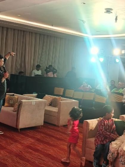 It's all about creating a connection. Here, our lead singer interacts with the audience, including the younger guests, making everyone feel like a part of the show at a private party.