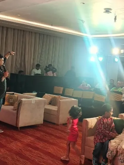 It's all about creating a connection. Here, our lead singer interacts with the audience, including the younger guests, making everyone feel like a part of the show at a private party.