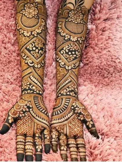 A stunning bridal design with a mix of modern and traditional elements. The contrast between the filled and empty spaces makes the pattern pop.