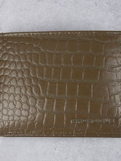 A closed, front-facing shot of the olive green crocodile wallet.