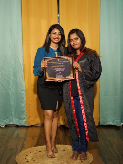 Presenting a certificate to another deserving student.