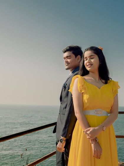 Sunshine and sea breezes. This bright yellow dress is a cheerful and beautiful choice for a pre-wedding shoot by the ocean, creating light and happy memories.