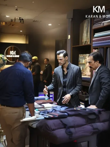 Kabir engaging with a client over fabric selections. This client-first approach is central to our philosophy, ensuring the final garment is made to matter.