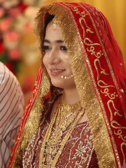 Another candid moment, showing the beautiful details of her embroidered dupatta and how the makeup complements the rich colors.