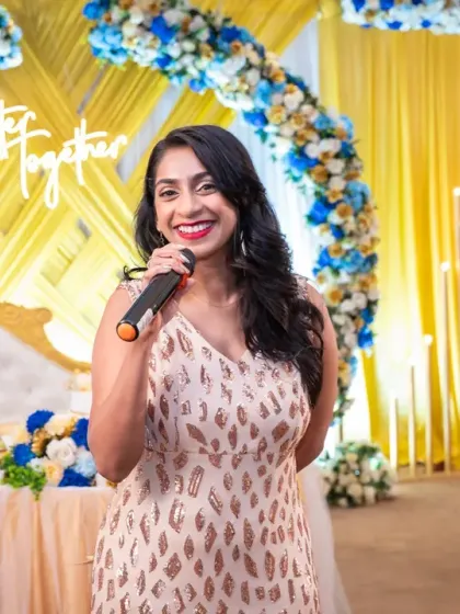 The host of a beautiful golden wedding anniversary party, setting the stage for a memorable celebration. Event photography is about capturing all the key players.