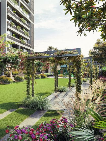 A trellised walkway during the day, demonstrating how structural elements are designed to be enveloped by nature over time, creating shaded, pleasant pathways.