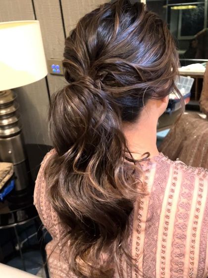 A final shot of the stylish messy low ponytail.