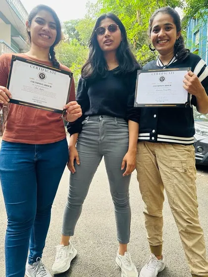 "No more a pillion!" These graduates proudly display their certificates, a testament to their hard work and the freedom they've earned.