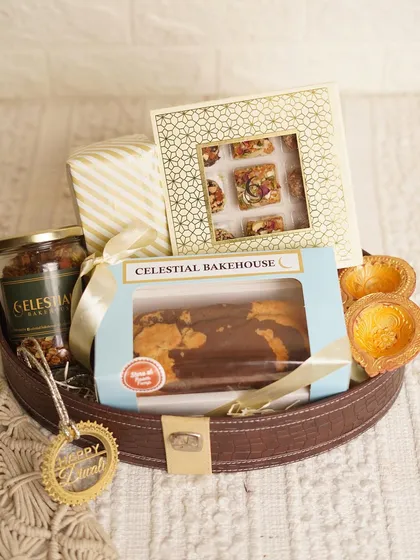 This beautifully styled shot captures the magic of our Diwali hamper, filled with sweet delights that shine as bright as the festival itself.