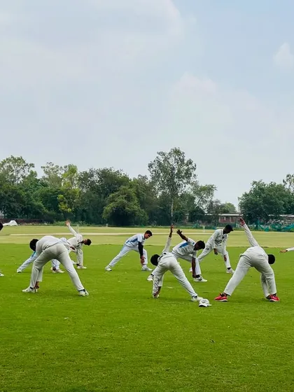 A synchronized stretching drill. This shows the unity and discipline of our team even during warm-ups.
