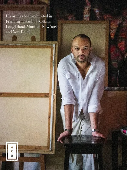 A powerful portrait of artist Pushkar Thakur in his studio, leaning against a stool. The image includes text about his international exhibitions.