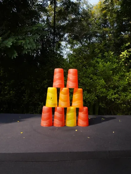 A simple yet fun cup stacking game set up for guests to play. These small activity stations are perfect for keeping guests entertained during a company festival.