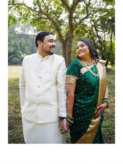 A classic, happy portrait of the engaged couple, holding hands and sharing a smile.