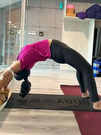 Advanced yoga postures like the Wheel Pose (Chakrasana) are taught with careful instruction. This pose is excellent for building back strength and opening the heart.