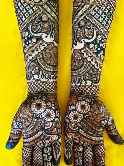 This full-arm design is a masterpiece of symmetry and detail, featuring peacocks, florals, and intricate geometric work that flows seamlessly.