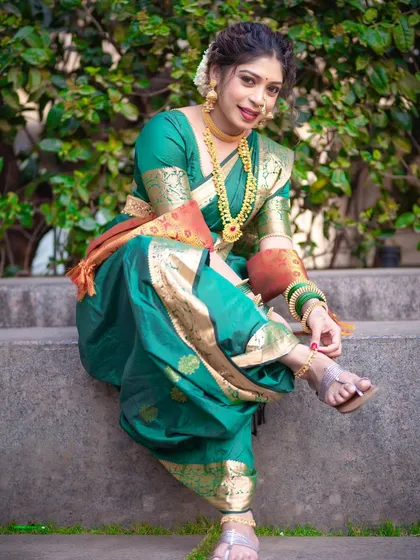 The Nauvari drape is not just beautiful but also practical. This seated pose shows the comfort and flexibility of the dhoti-style drape, rooted in Maharashtrian history.