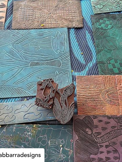 Our collaboration with the artisans of Bábbarra Designs is a story that continues to unfold. Here, they are selecting historic lino tiles which our artisans will translate into durable teak woodblocks, preserving their craft for a new generation.