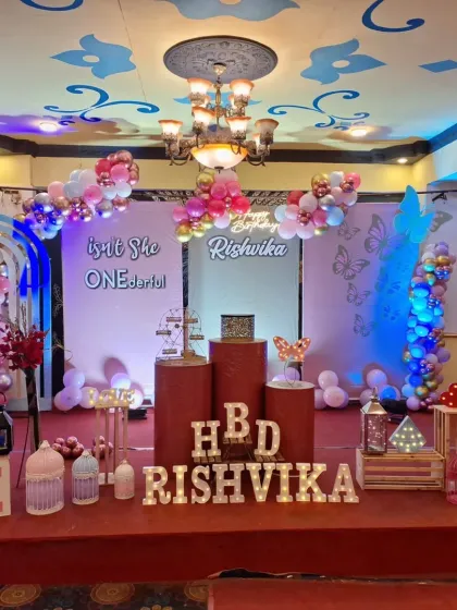 Another angle of the "ONEderful" butterfly-themed first birthday, showcasing the full stage with different plinth heights and a balanced arrangement of props.
