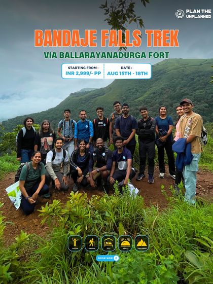 A group of trekkers on the trail for the Bandaje Falls trek, surrounded by the lush greenery of the Western Ghats.