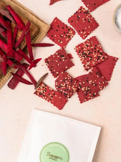 My vibrant Beetroot Crackers, made with the natural goodness of beetroot and sprinkled with sesame seeds. They are crunchy, tasty, and a great way to snack colourfully.