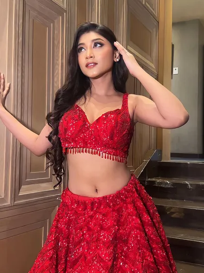 Our vision for cocktail makeup is to make a statement. This look is all about confidence, with a bold red lehenga and makeup that is both glamorous and modern.