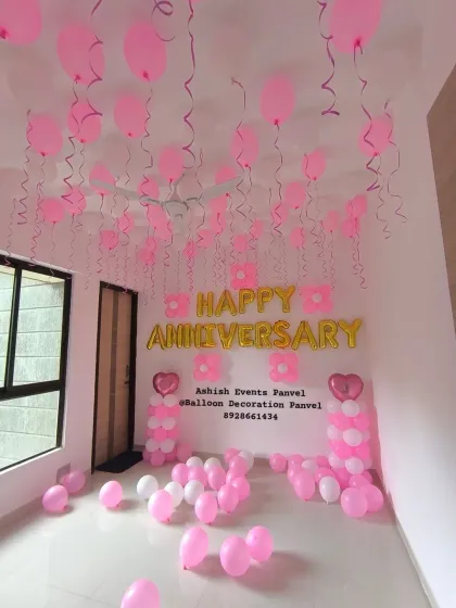A simple yet romantic anniversary room decoration. I use ceiling balloons with ribbons, balloon pillars, and foil letter balloons to create a surprise that fills the entire space with love.
