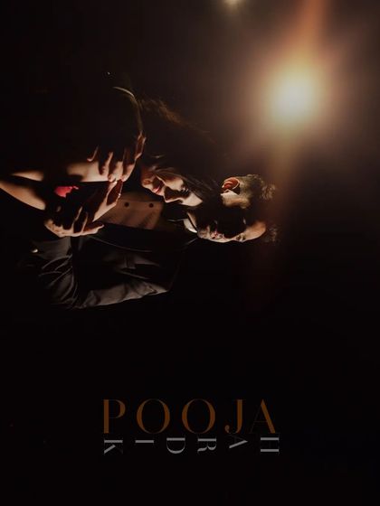 A creative pre-wedding portrait with a reflection, adding a layer of artistry and intrigue to the couple's story.