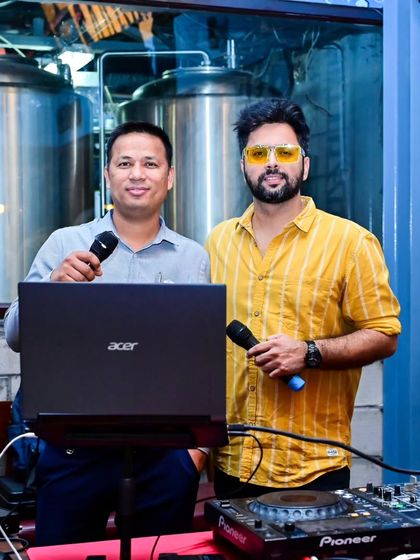 Here with one of the night's talented singers. I'm always there to support the performers, whether it's helping with a cue or singing along with them.