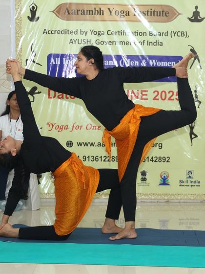 A beautiful partner stretch that combines Natarajasana (Dancer's Pose) with a gentle backbend. Pair yoga allows practitioners to achieve deeper stretches and more complex poses with mutual support.
