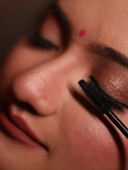 The final touches are what bring a look together. Here, I'm applying mascara to add volume and definition, a crucial step in making the eyes pop and ensuring the makeup looks perfect from every angle.
